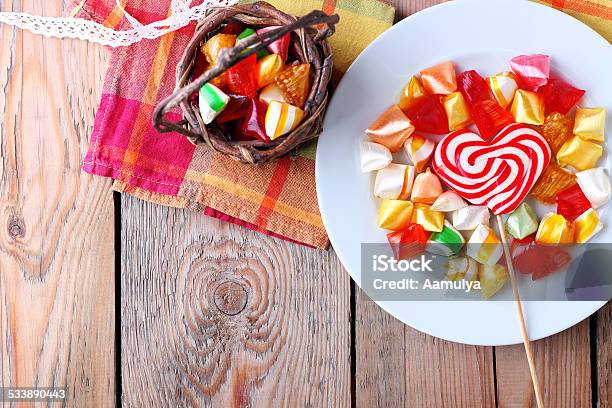 Plate And Basket With Colorful Sweet Candies Stock Photo - Download Image Now - 2015, Basket, Candy