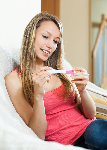 istock Girl with pregnancy test 533891763