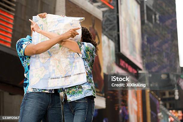 Couple With A Map Stock Photo - Download Image Now - Humor, Lost, Map