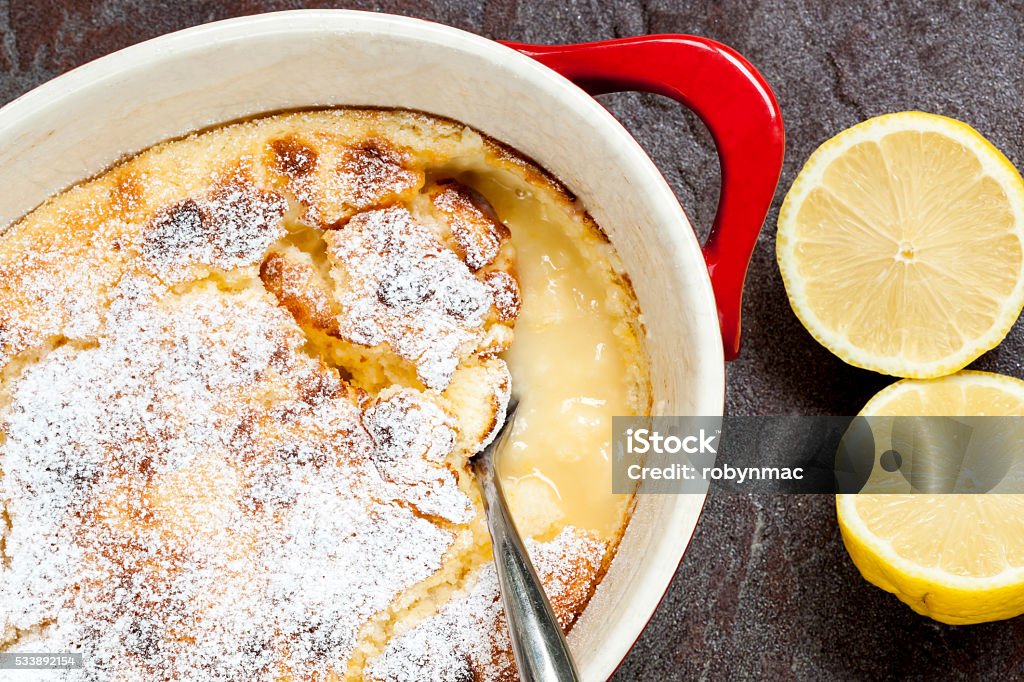Traditional English Lemon Pudding Traditional English lemon pudding, in baking dish. Lemon Mousse Stock Photo