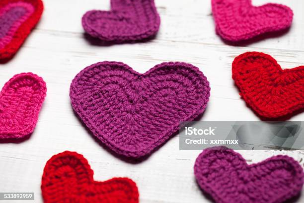 Crochet Hearts On White Table Stock Photo - Download Image Now - 2015, Close-up, Color Image