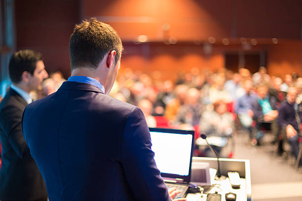 Speaker at Business Conference and Presentation. Speaker at Business Conference and Presentation. Audience at the conference hall. summit meeting photos stock pictures, royalty-free photos & images