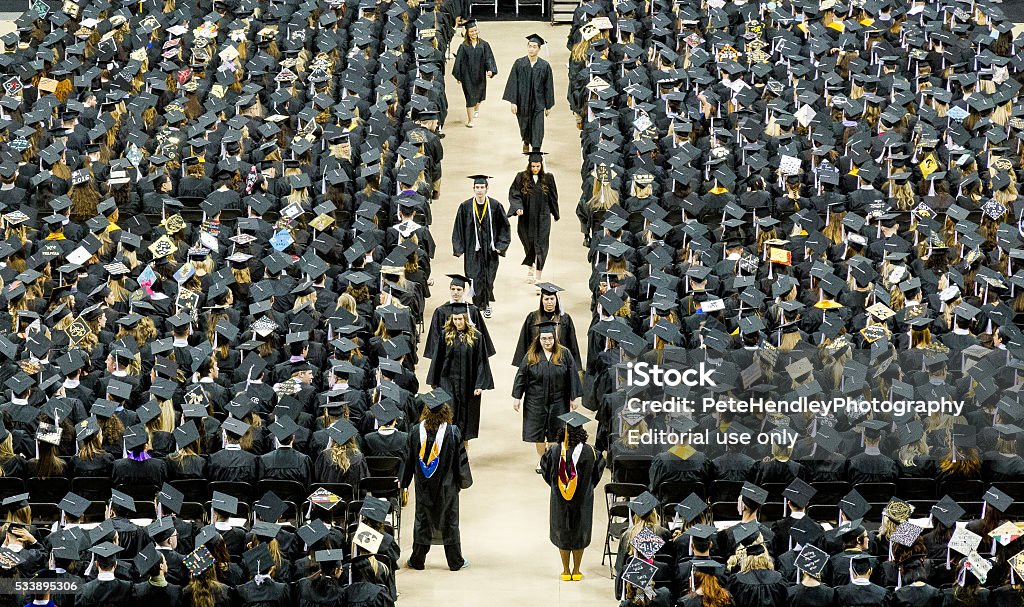 University Graduation Ceremony Iowa City, USA - May 14, 2016 University Of Iowa graduation ceremony for the  College of Liberal Arts & Sciences. The 9:00 AM ceremony. An estimated 1,000 graduates and 3,000 audience members.The Iowa Hawkeyes. Graduation Stock Photo