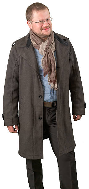 istock Middle-aged man in a coat and scarf looking friendly 533899550