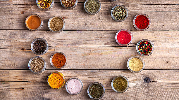 istock Spices in jars on wooden background. Food 533899896