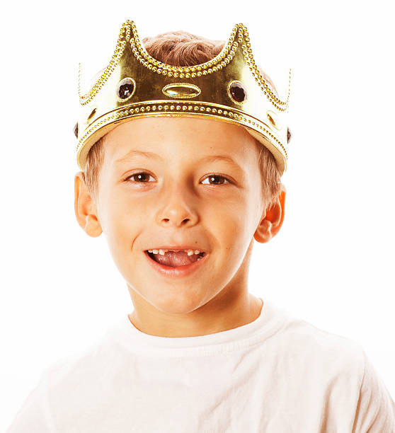 istock little cute boy wearing crown isolated close up on white 533900540