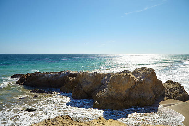 istock Waves beating against coastal rocks on the cliffs 533902926