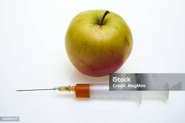 Apple Or Injector Your Choice Stock Photo - Download Image Now - 2015, Apple - Fruit, Cut Out