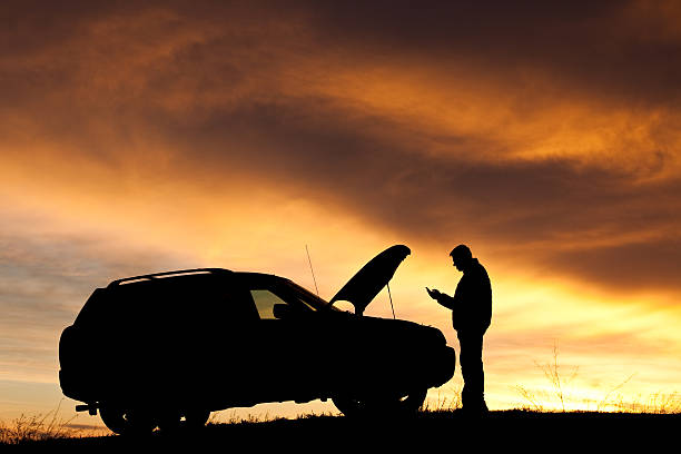 istock Man With Car Trouble Texting For Roadside Assistance 533904571