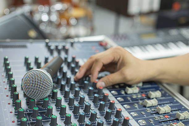 istock music equipment mic and blur hand adjust audio mixer 533904908