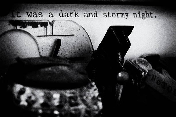 It was a Dark and Stormy Night - Film Noir The inside of an old IMB Selectric II typwriter that has typed "It was a dark and stormy night."  Blank and white, film nior style with film grain. typewriter photos stock pictures, royalty-free photos & images