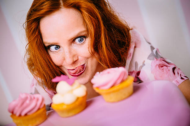 istock Young Woman Really Wants To Eat Cupcakes 533906455