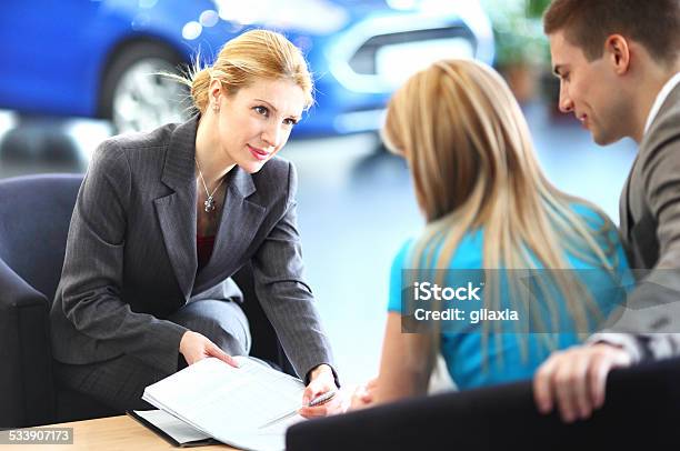 Cr Sales Representative Talking To Clients Stock Photo - Download Image Now - 2015, Adult, Automobile Industry