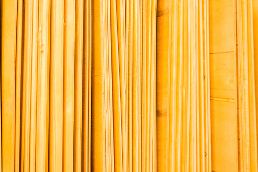 Plywood sheets in the warehouse. In yellow tones