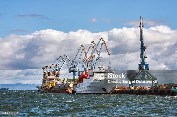 Cargo Ship Docked Pier Port Stock Photo - Download Image Now - 2015, Blue, Business