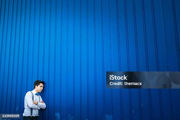 Young Man Standing With Blue Background Stock Photo - Download Image Now - 20-29 Years, 2015, Adult