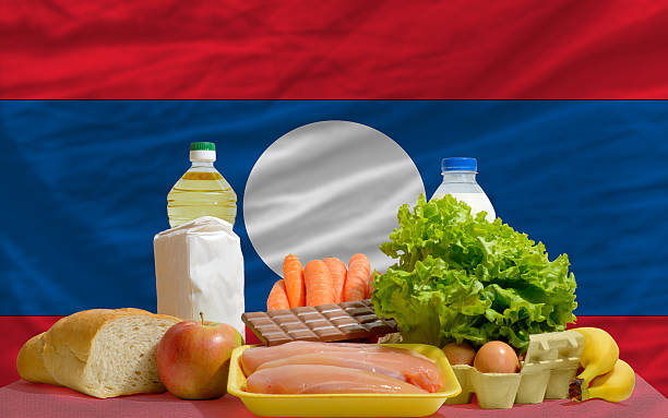 istock basic food groceries in front of laos national flag 533909487