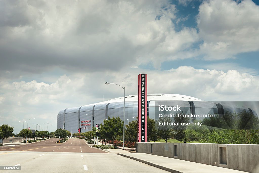The University of Phoenix Stadium in Glendale Glendale, Arizona, Usa - August 22, 2012: Outdoors view of the University of Phoenix Stadium in Glendale, it is the stadium of the Arizona Cardinals football american team. The Stadium is situated in Glendale, about 6 miles far from Phoenix. It was built on 2006. Parking Lot Stock Photo