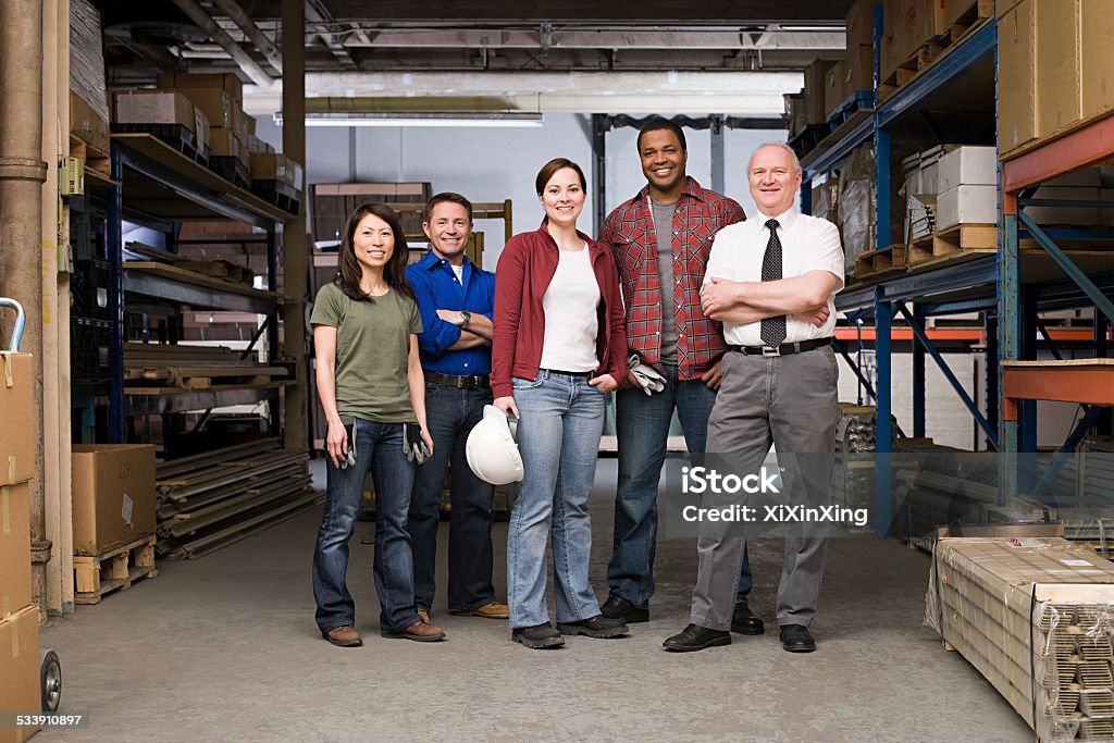 Workers in warehouse Working Class Stock Photo