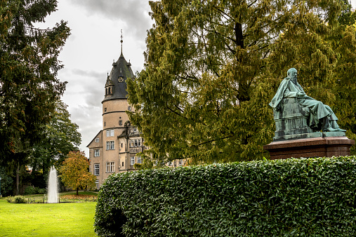 Sculpture statue of Hans Christian Andersen in front of sct Knud cathedral, Odense Denmark