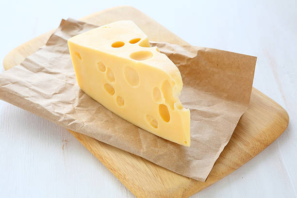 istock Swiss cheese on a cutting board 533911897