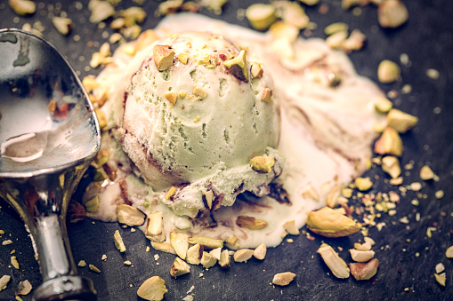 Homemade pistachio ice cream witch chopped pistachios. This creamy delicious ice cream is a perfect treat on a sunny day.