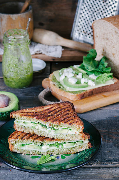 istock Healthy sandwich with cheese, pesto, avocado and spinach 533915952