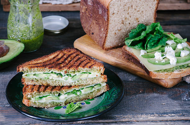 istock Healthy sandwich with cheese, pesto, avocado and spinach 533916040