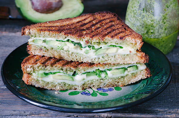 istock Sandwich with cheese, pesto, avocado and spinach 533916110