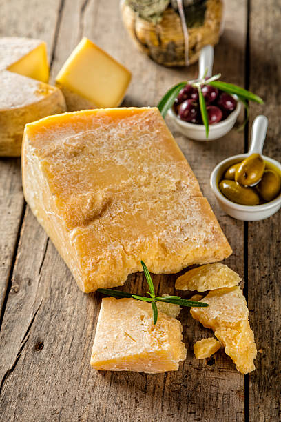 istock Parmesan cheese on cutting board placed on wood 533921792
