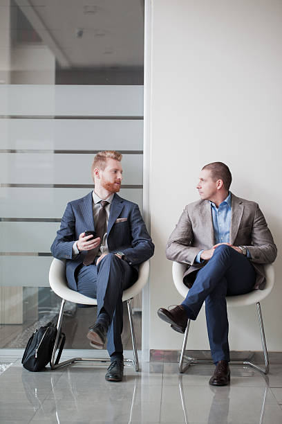 istock Two business people talking and waiting on a job interview 533922370