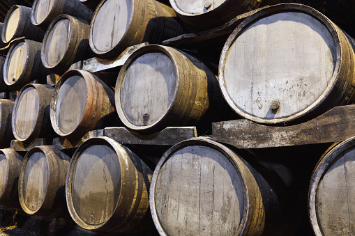 Old Porto wine cellar with wooden barrels in Porto, Portugal