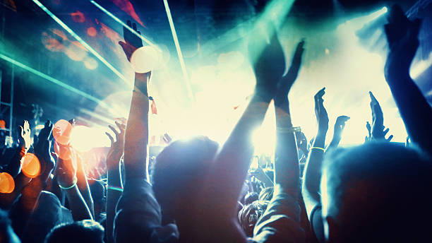 istock People at concert party. 533923124