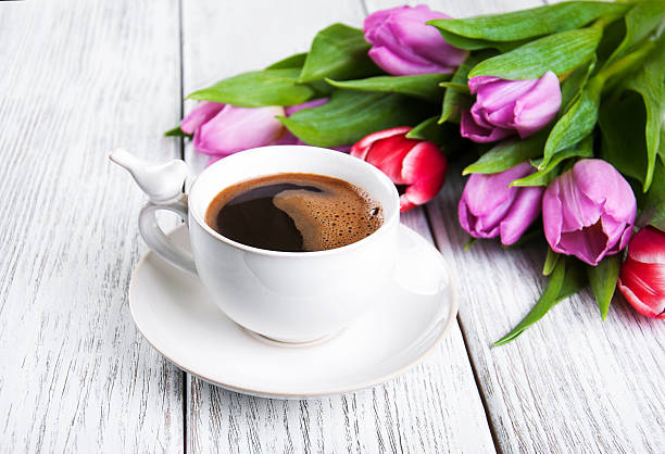 istock cup of coffee with tulips 533923128