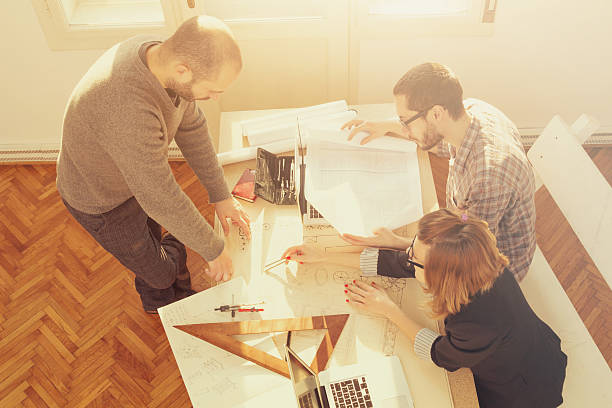 istock Young group of people/architects discussing business plans 533923194