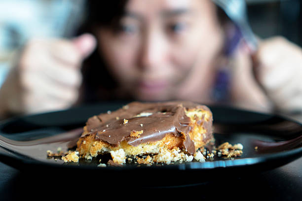 girl eating crushed donut cake