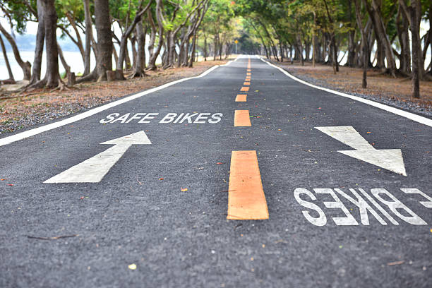 istock Safe bikes words with white arrow sign marking on road 533923624
