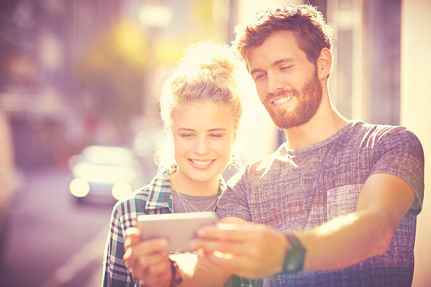 istock Happy couple taking selfie through smart phone 533924016
