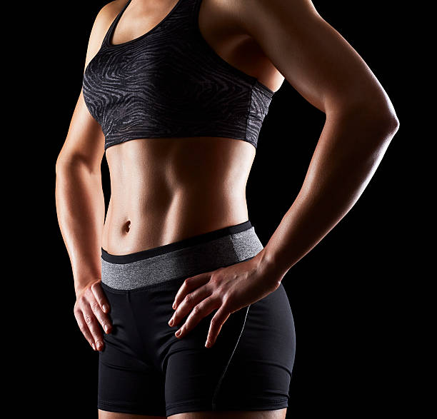 istock Determined fit female is showing off her abs 533924236