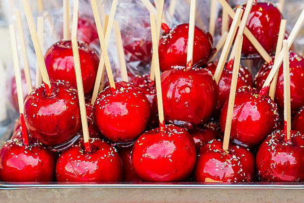 istock Sweet glazed red toffee candy apples on sticks 533924456