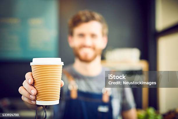 Barista Offering Coffee In Disposable Cup Stock Photo - Download Image Now - Coffee - Drink, Cafe, Front View