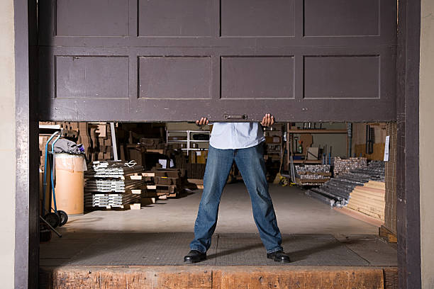 Opening warehouse door Opening warehouse door garage stock pictures, royalty-free photos & images