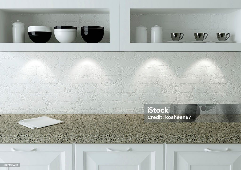 White kitchen design. Ceramic kitchenware on the shelf. Marble worktop. White kitchen design. 2015 Stock Photo