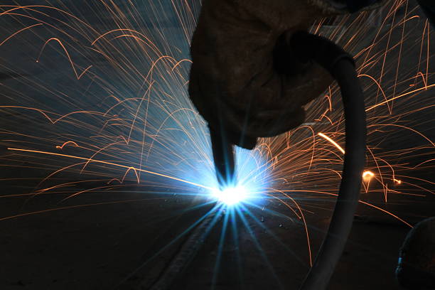 istock Welder is welding work piece with gloves safety 533934149