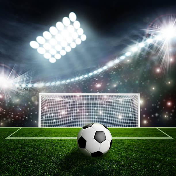 istock Soccer ball on green stadium arena 533934411