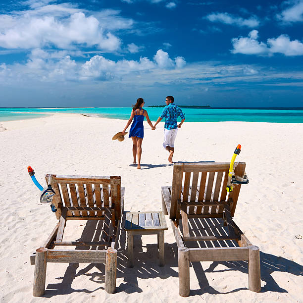 istock Couple running on a beach at Maldives 533934447