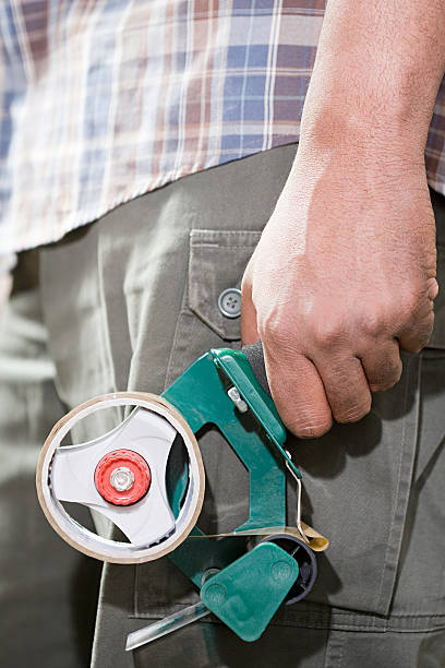 istock Person holding adhesive tape 533936661