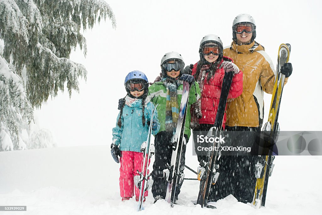 Family with skis Skiing Stock Photo