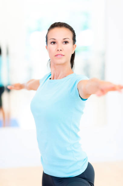 istock Young Woman Yogi Practicing Yoga in Studio 533940061