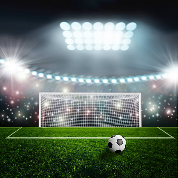 istock Soccer ball on green stadium arena 533955973